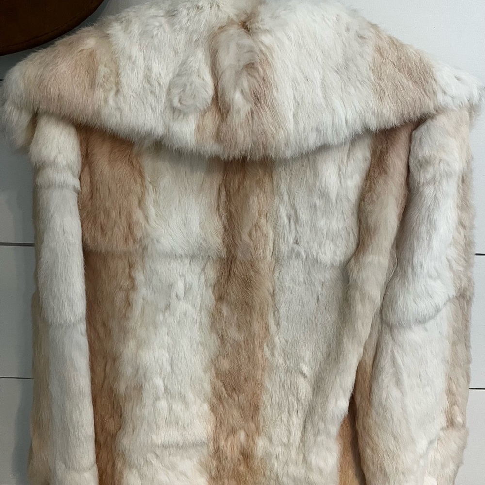 Size Medium real rabbit fur coat. Brand New, still has the tags.